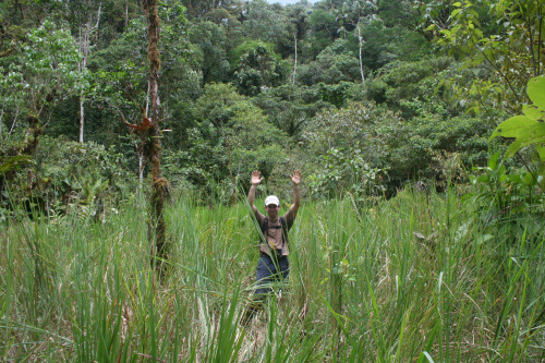 Even with his hands up, Benjamin shows how tall and aggressive the grass is here. Photo by Benjamin Skolnik